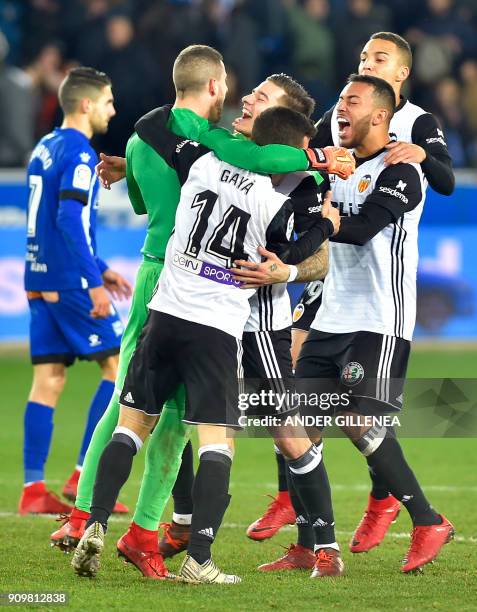 Valencia players celebrate at the end of the Spanish 'Copa del Rey' quarter-final second leg football match between Deportivo Alaves and Valencia CF...