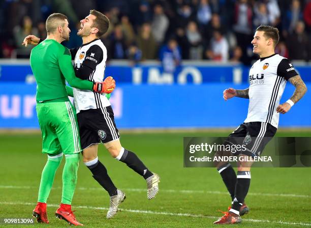 Valencia players celebrate at the end of the Spanish 'Copa del Rey' quarter-final second leg football match between Deportivo Alaves and Valencia CF...