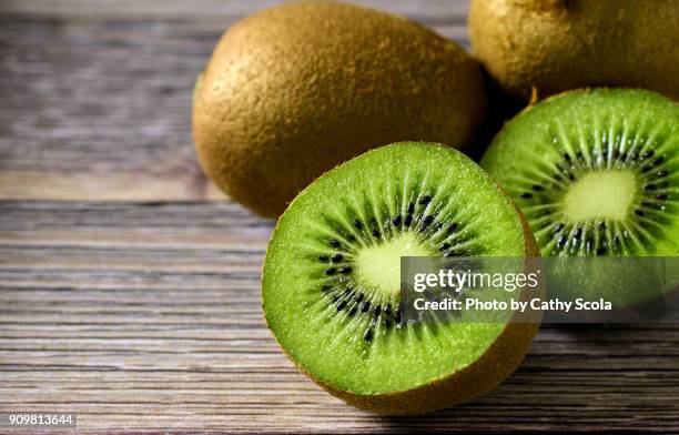 sliced kiwi - kiwi fruit stock pictures, royalty-free photos & images