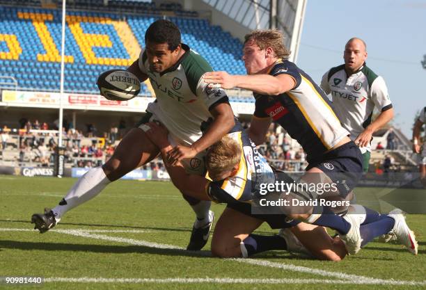 Chris Hala'ufia of London Irish dives over to score his second try despite being held by Scott Armstrong during the Guinness Premiership match...