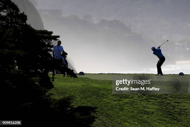 Tiger Woods hits a shot on the 16th tee during the pro-am round of the Farmers Insurance Open at Torrey Pines Golf Course on January 24, 2018 in San...