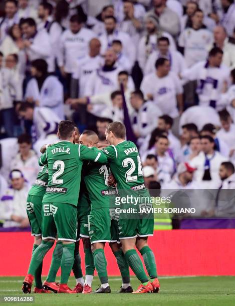 Leganes players celebrate a goal during the Spanish 'Copa del Rey' quarter-final second leg football match between Real Madrid CF and CD Leganes at...