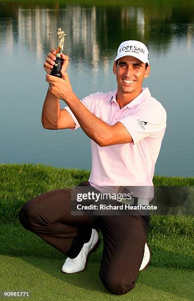 Rafael Cabrera-Bello of Spain celebrates with the trophy after shooting a final round 60 and seal a 1 shot victory during the fourth round of the...