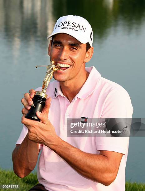 Rafael Cabrera-Bello of Spain celebrates with the trophy after shooting a final round 60 and seal a 1 shot victory during the fourth round of the...