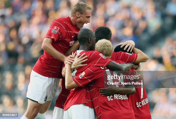 Cedric Makiadi of Freiburg celebrates with his team mates after scoring his team's second goal during the Bundesliga match between Hertha BSC Berlin...