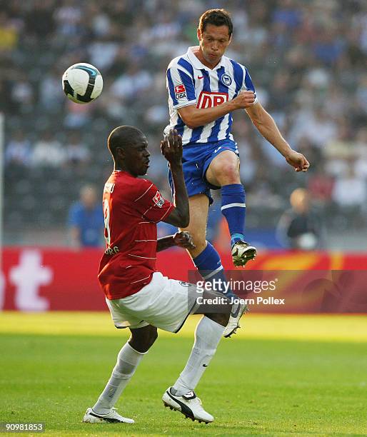 Pal Dardai of Berlin and Mohamadou Idrissou of Freiburg battle for the ball during the Bundesliga match between Hertha BSC Berlin and SC Freiburg at...