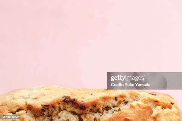 valentine's day banana bread against soft pink-color background - banana loaf stock-fotos und bilder