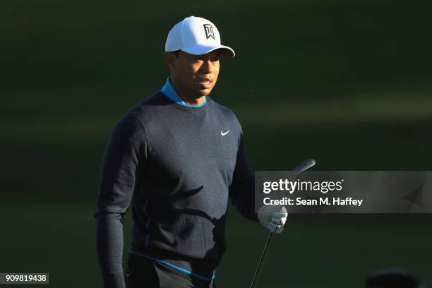 Tiger Woods looks on at the ninth hole during the pro-am round of the Farmers Insurance Open at Torrey Pines Golf Course on January 24, 2018 in San...