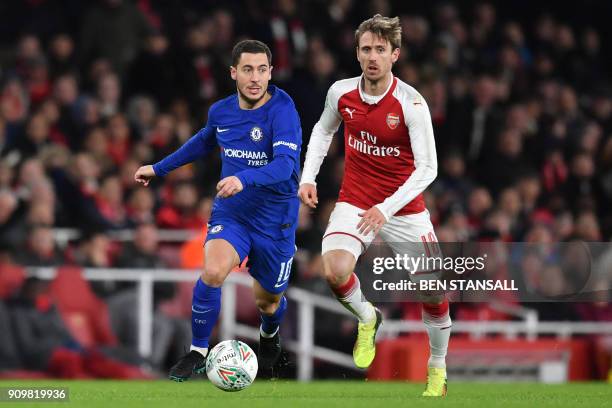 Chelsea's Belgian midfielder Eden Hazard vies with Arsenal's Spanish defender Nacho Monreal during the League Cup semi-final football match between...