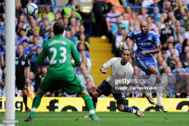 Nicolas Anelka of Chelsea shoots past Benoit Assou-Ekotto of Spurs at the goalmouth of Carlo Cudicini of Spurs during the Barclays Premier League...