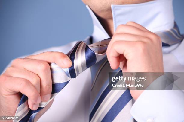 tie a necktie 2 - fingertier stock pictures, royalty-free photos & images