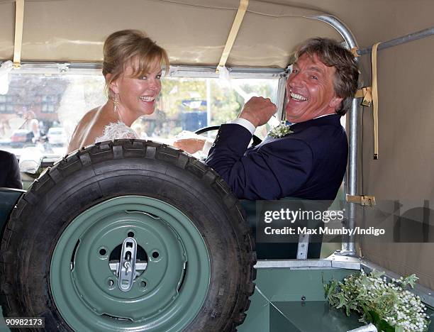 Eimear Montgomerie and new husband Nick Cook leave St. Nicholas Church in a canvas roofed Land Rover after their wedding on September 20, 2009 in...