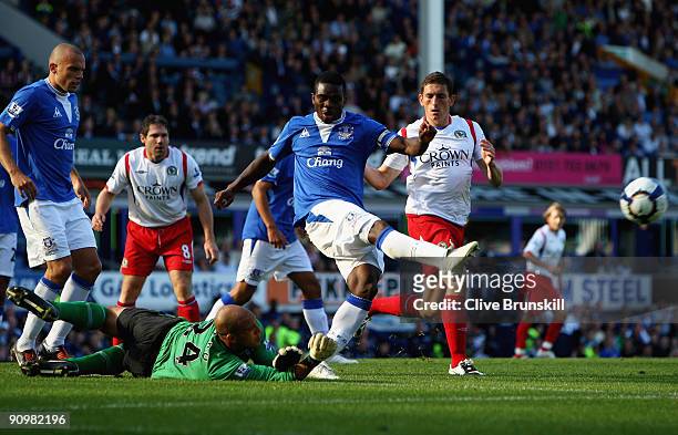Joseph Yobo of Everton clears a dangerous ball as his keeper Tim Howard watches on during the Barclays Premier League match between Everton and...