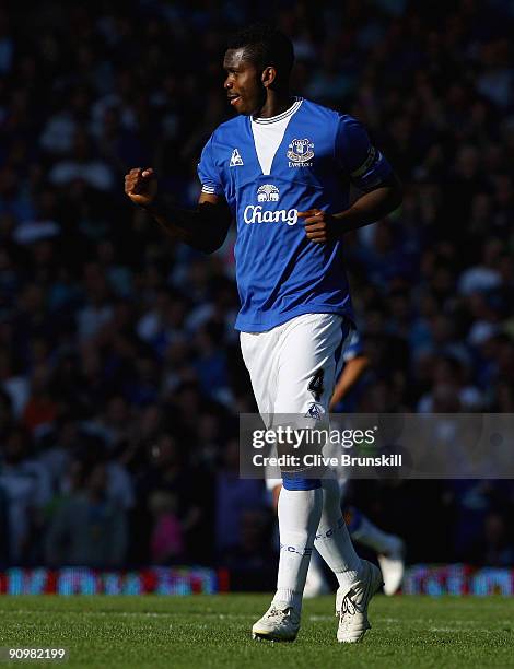 Joseph Yobo of Everton runs back down the pitch to celebrate after scoring the third goal during the Barclays Premier League match between Everton...