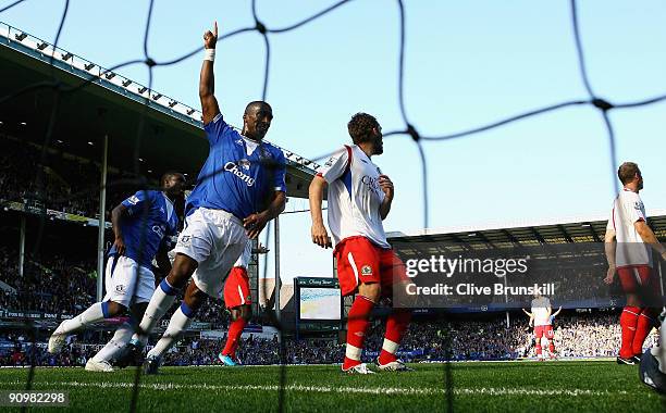 Sylvain Distin of Everton celebrates teammate Louis Saha's opening goal during the Barclays Premier League match between Everton and Blackburn Rovers...