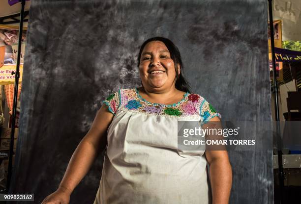 Obdulia Juan Antonio poses for a photograph on October 5, 2016 at the Mole Fair in San Pedro Atocpan, Milpa Alta borough, near Mexico City's inner...