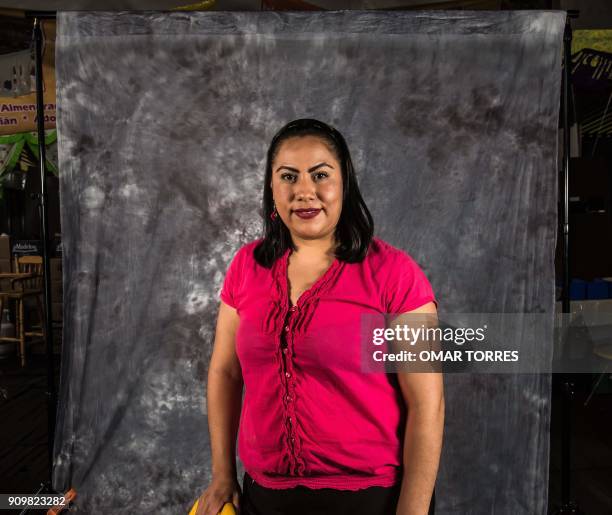 Aide Espinoza Gonzalez poses for a photograph on October 5, 2016 at the Mole Fair in San Pedro Atocpan, Milpa Alta borough, near Mexico City's inner...