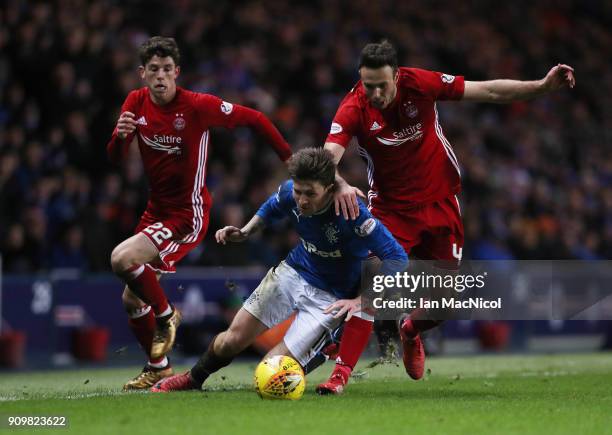 Josh Windass of Rangers vies with Andrew Considine of Aberdeen during the Ladbrokes Scottish Premiership match between Rangers and Aberdeen at Ibrox...