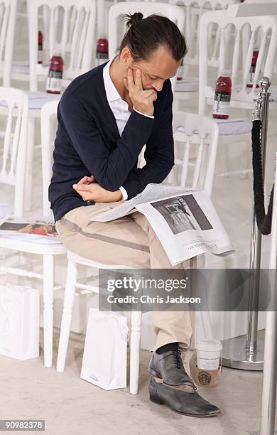 Designer Matthew Williamson sits on the front row at the Matthew Williamson Spring/Summer 2010 show at Howick Place during London Fashion Week on...