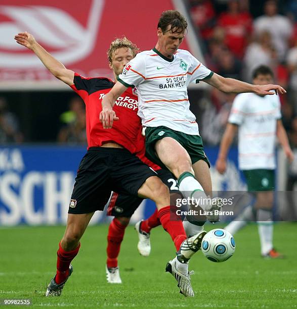 Simon Rolfes of Leverkusen challenges Tim Borowski of Bremen during the Bundesliga match between Bayer Leverkusen and Werder Bremen at BayArena on...