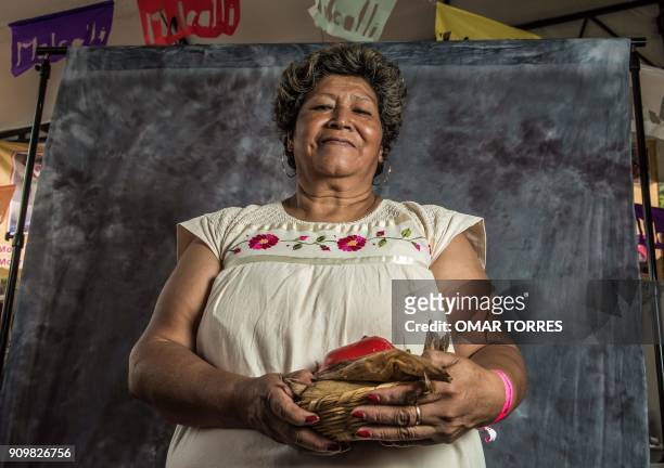 Paula Caballero Flores poses for a photograph on October 5, 2016 at the Mole Fair in San Pedro Atocpan, Milpa Alta borough, near Mexico City's inner...