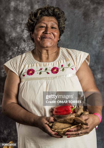 Paula Caballero Flores poses for a photograph on October 5, 2016 at the Mole Fair in San Pedro Atocpan, Milpa Alta borough, near Mexico City's inner...