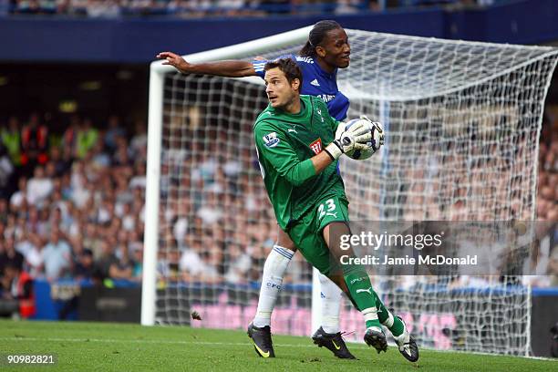 Tottenham Hotspur goalkeeper Carlo Cudicini makes a save in front of Didier Drogba of Chelsea during the Barclays Premier League match between...