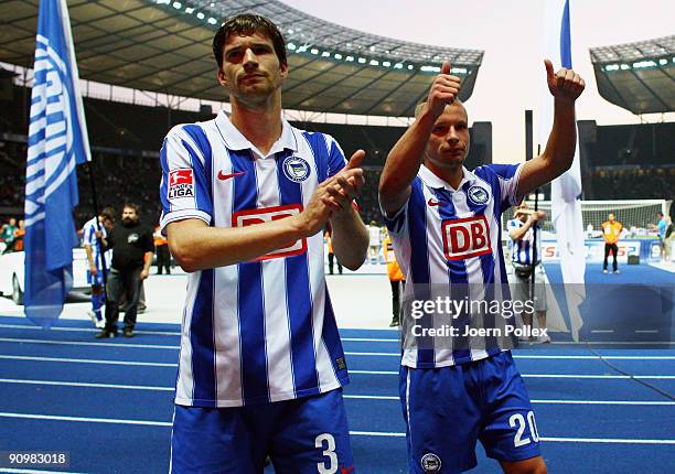 Patrick Ebert and Arne Friedrich of Berlin talk to the fans after the Bundesliga match between Hertha BSC Berlin and SC Freiburg at Olympic Stadium...