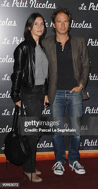 Actors Geraldine Pailhas and Christopher Thomson attend the Premiere of "Le Petit Nicolas" film at Le Grand Rex on September 20, 2009 in Paris,...