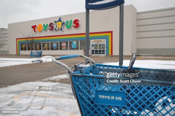 Shopping cart sits in the parking lot at a Toys "R" Us store on January 24, 2018 in Highland Park, Illinois. The store is one of more than 180 Toys...