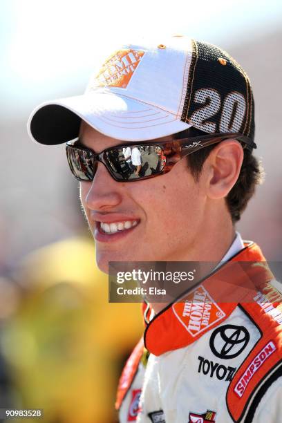 Joey Logano, driver of the Home Depot Toyota, looks on from the grid prior to the NASCAR Sprint Cup Series Sylvania 300 at the New Hampshire Motor...