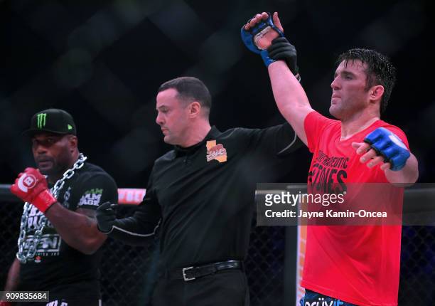 Referee Mike Beltran raises the arm of Chael Sonnen as he defeated Quinton Jackson in their Heavyweight World Title fight at Bellator 192 at The...