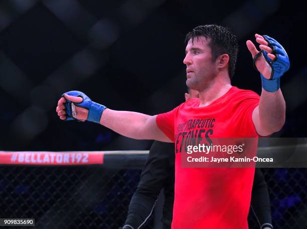 Referee Mike Beltran raises the arm of Chael Sonnen as he defeated Quinton Jackson in their Heavyweight World Title fight at Bellator 192 at The...