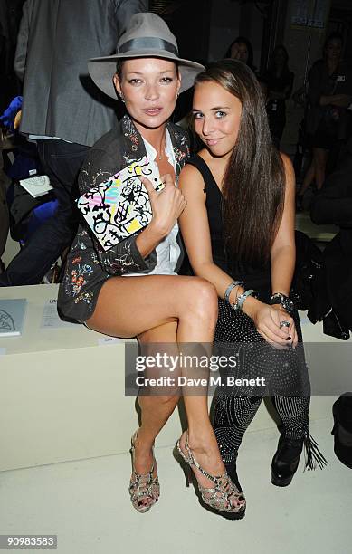 Kate Moss and Chloe Green attend the Unique show during London Fashion Week, on September 20, 2009 in London, England.