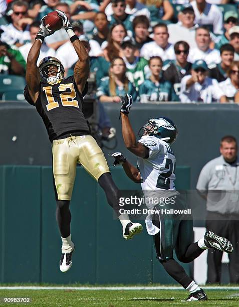 Wide receiver Marques Colston of the New Orleans Saints catches a pass for a touchdown over cornerback Joselio Hanson of the Philadelphia Eagles on...