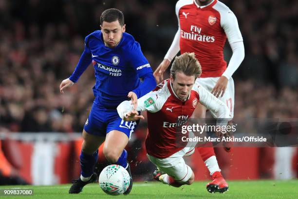 Eden Hazard of Chelsea and Nacho Monreal of Arsenal go down as they battle for the ball during the Carabao Cup Semi-Final 2nd leg match between...