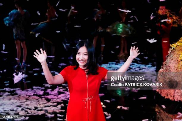 Chinese fashion designer Guo Pei acknowledges the audience at the end of her fashion show during the 2018 spring/summer Haute Couture collection on...