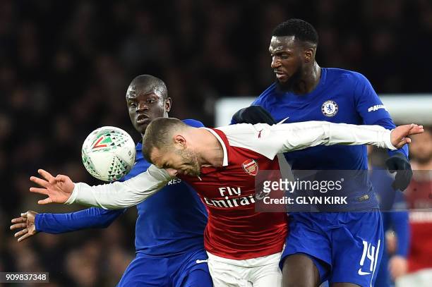 Arsenal's English midfielder Jack Wilshere vies with Chelsea's French midfielder N'Golo Kante and Chelsea's French midfielder Tiemoue Bakayoko during...