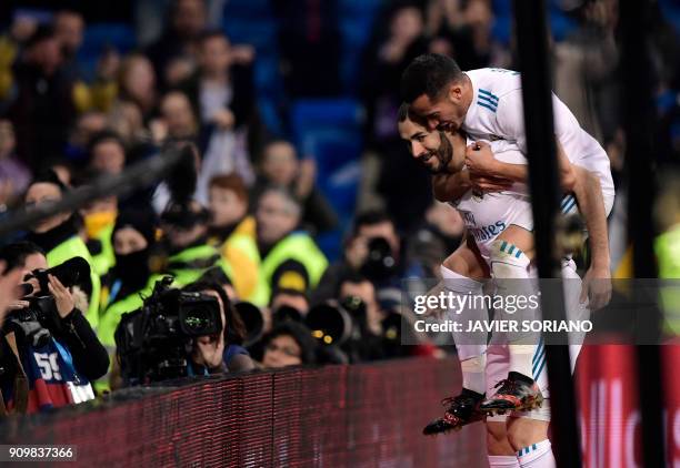 Real Madrid's French forward Karim Benzema celebrates a goal with Real Madrid's Spanish midfielder Lucas Vazquez during the Spanish 'Copa del Rey'...