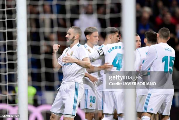 Real Madrid's French forward Karim Benzema celebrates a goal with teammates during the Spanish 'Copa del Rey' quarter-final second leg football match...