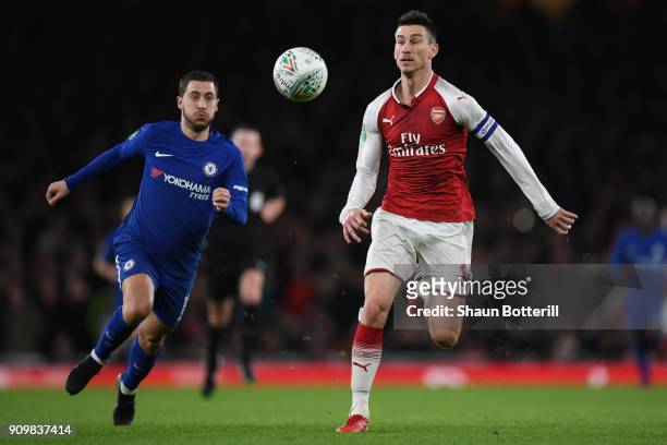 Laurent Koscielny of Arsenal and Eden Hazard of Chelsea chase the ball during the Carabao Cup Semi-Final Second Leg at Emirates Stadium on January...