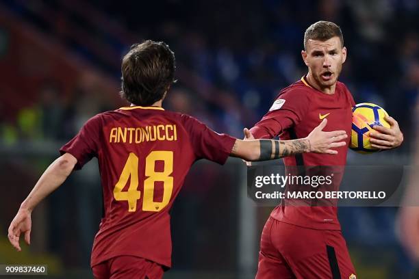 Roma's Bosnian forward Edin Dzeko celebrates with AS Roma's Italian midfielder Mirko Antonucci after scoring a goal during the Italian Serie A...