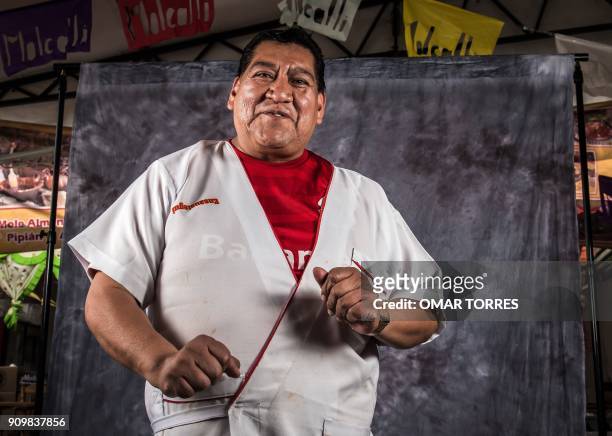 Pedro Ensaustegui Bernal poses for a photograph on October 5, 2016 at the Mole Fair in San Pedro Atocpan, Milpa Alta borough, near Mexico City's...