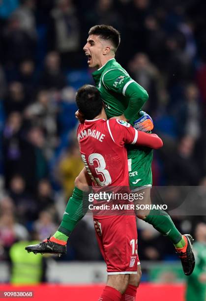 Leganes' Spanish defender Unai Bustinza celebrates with Leganes' Argentinian goalkeeper Nereo Champagne their qualification for semifinals at the end...