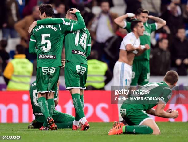 Leganes players celebrate their qualification for semifinals at the end of the Spanish 'Copa del Rey' quarter-final second leg football match between...