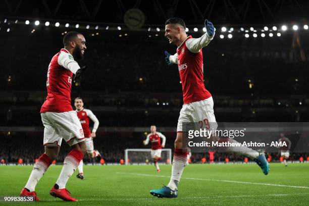 Granit Xhaka of Arsenal celebrates after scoring a goal to make it 2-1 during the Carabao Cup Semi-Final Second Leg match between Arsenal and Chelsea...