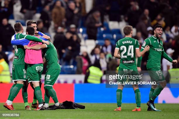 Leganes players celebrate their qualification for semifinals at the end of the Spanish 'Copa del Rey' quarter-final second leg football match between...