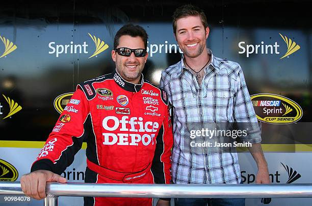 Tony Stewart , driver of the Old Spice/Office Depot Chevrolet poses with country music singer Josh Turner , prior to the start of the NASCAR Sprint...