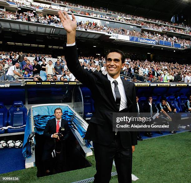 Alberto Contador greets fans before the La Liga match between Real Madrid and Xerez CD at Estadio Santiago Bernabeu on September 20, 2009 in Madrid,...