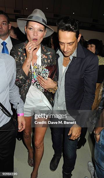 Kate Moss and Jamie Hince attend the Unique show during London Fashion Week, on September 20, 2009 in London, England.